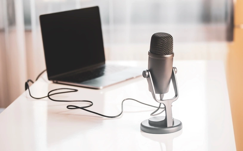 Microphone and laptop for podcast recording